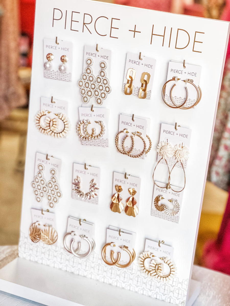 Wholesale Custom Spinning Display – Pierce & Hide